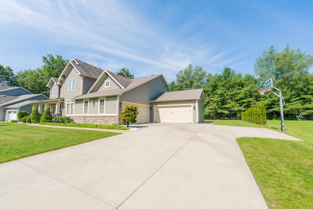 7226 Breton Woods Ct, Kalamazoo, MI 49009 - craftsman inspired home with an attached garage, concrete driveway, stone siding, and a front yard