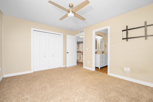 7226 Breton Woods Ct, Kalamazoo, MI 49009 - unfurnished bedroom featuring carpet flooring, a closet, ensuite bath, and ceiling fan