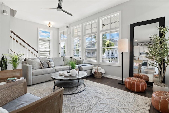 230 Cavelier Ave, Saint Joseph, MI 49085 - living room featuring dark wood finished floors, a ceiling fan, and stairway