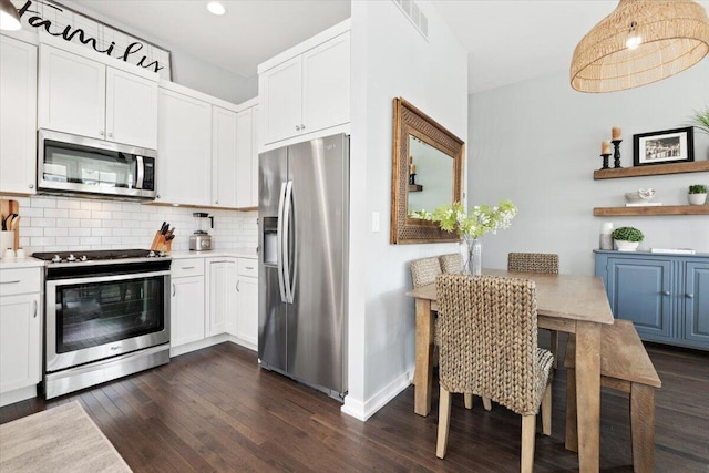230 Cavelier Ave, Saint Joseph, MI 49085 - kitchen with stainless steel appliances, dark wood-style flooring, backsplash, light countertops, and recessed lighting