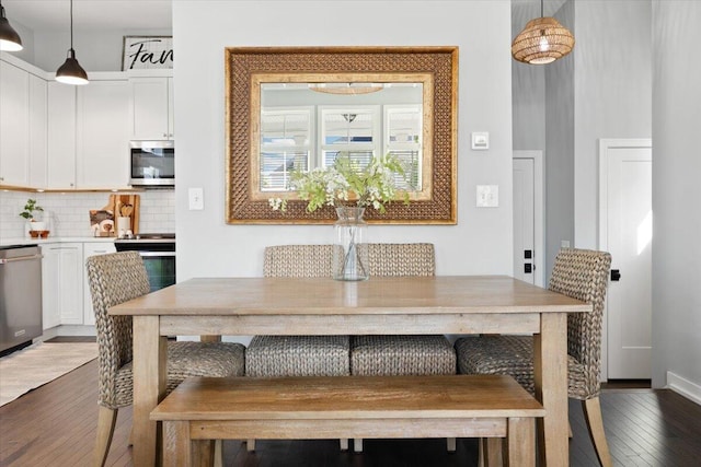 230 Cavelier Ave, Saint Joseph, MI 49085 - dining area featuring dark wood-style floors and baseboards