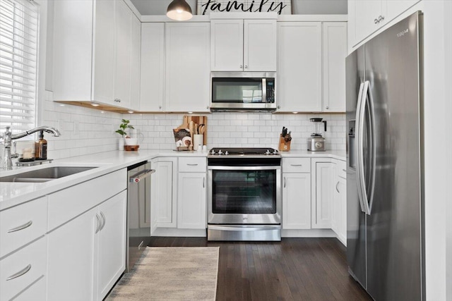 230 Cavelier Ave, Saint Joseph, MI 49085 - kitchen featuring appliances with stainless steel finishes, light countertops, and white cabinets