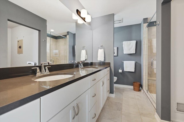 230 Cavelier Ave, Saint Joseph, MI 49085 - full bathroom featuring double vanity, a stall shower, and tile patterned floors