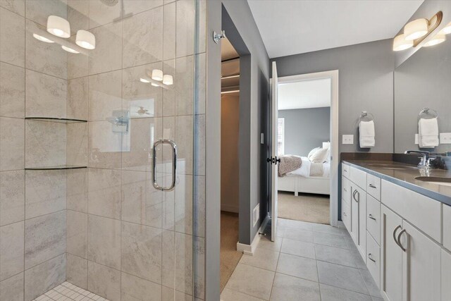 230 Cavelier Ave, Saint Joseph, MI 49085 - ensuite bathroom featuring a shower stall, double vanity, and tile patterned flooring