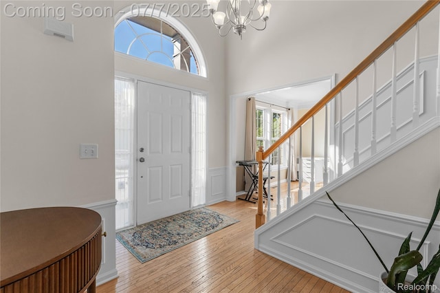 48840 Greenwich Cir, Canton, MI 48188 - foyer featuring light wood-type flooring and a chandelier