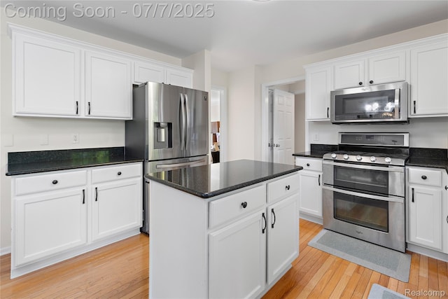 48840 Greenwich Cir, Canton, MI 48188 - kitchen with stainless steel appliances, light wood-type flooring, and white cabinetry