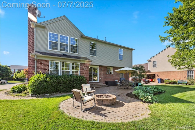 48840 Greenwich Cir, Canton, MI 48188 - back of house with a chimney, a yard, a patio, a fire pit, and brick siding
