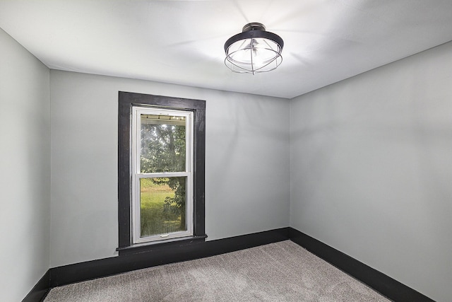 238 Maple Rd, Quincy, MI 49082 - unfurnished room with dark carpet and baseboards