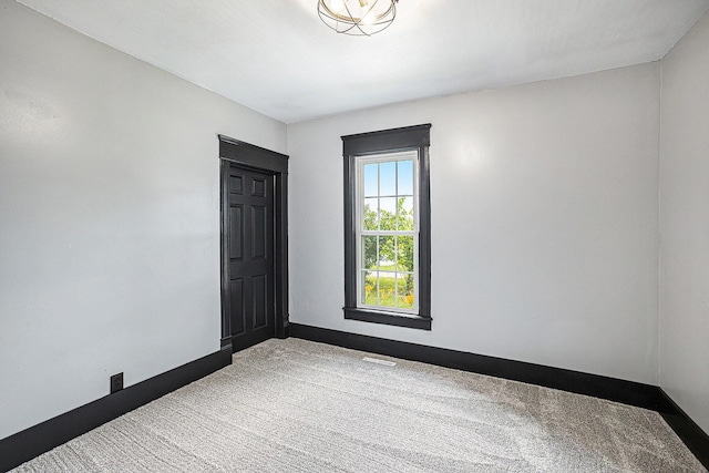 238 Maple Rd, Quincy, MI 49082 - carpeted spare room with baseboards