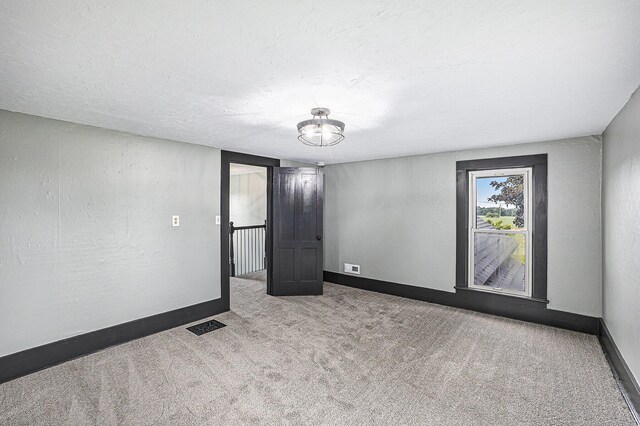 238 Maple Rd, Quincy, MI 49082 - unfurnished room featuring carpet floors and baseboards
