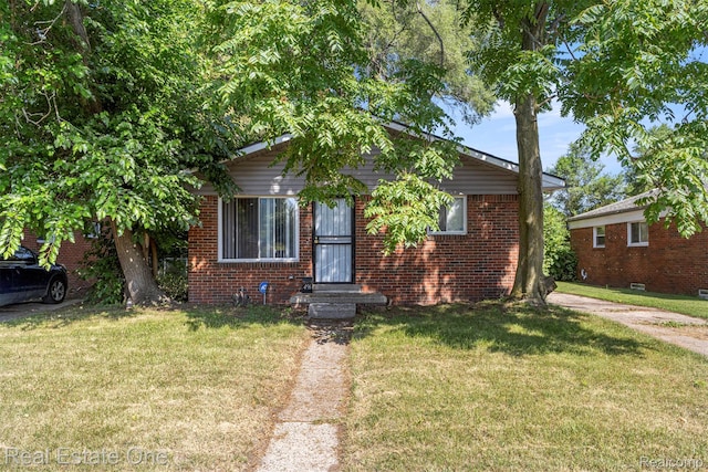 496 Lenoir Ave, River Rouge, MI 48218 - bungalow-style home featuring a front lawn and brick siding