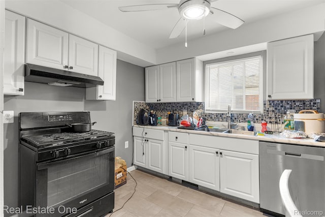 496 Lenoir Ave, River Rouge, MI 48218 - kitchen with black range with gas stovetop, under cabinet range hood, stainless steel dishwasher, tasteful backsplash, and ceiling fan
