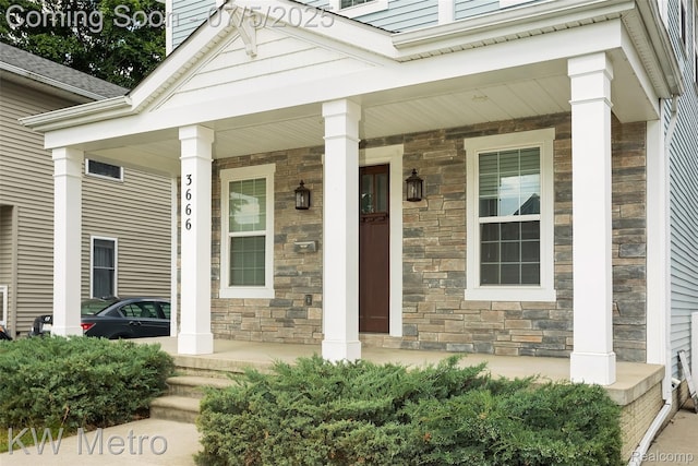 3666 Phillips Ave, Berkley, MI 48072 - doorway to property with covered porch and stone siding