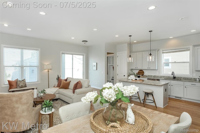 3666 Phillips Ave, Berkley, MI 48072 - living room featuring recessed lighting and light wood-style flooring