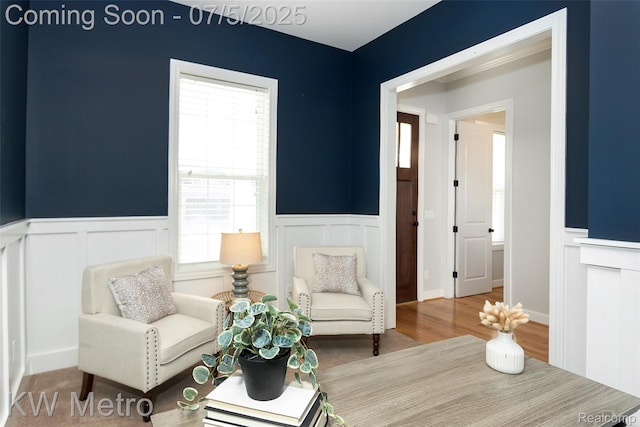 3666 Phillips Ave, Berkley, MI 48072 - living room featuring a decorative wall, wainscoting, plenty of natural light, and wood finished floors