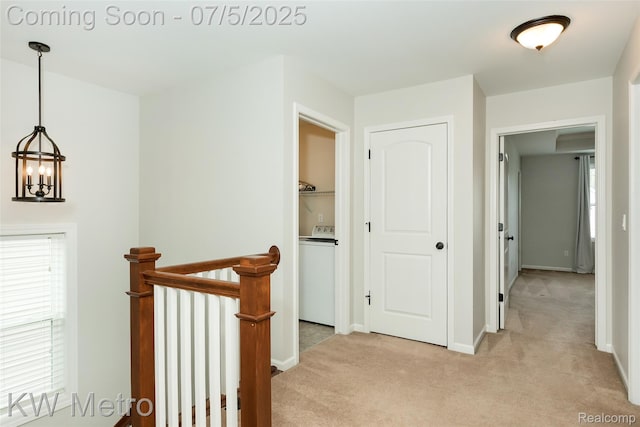 3666 Phillips Ave, Berkley, MI 48072 - hallway featuring washer / clothes dryer, an upstairs landing, light carpet, and a chandelier
