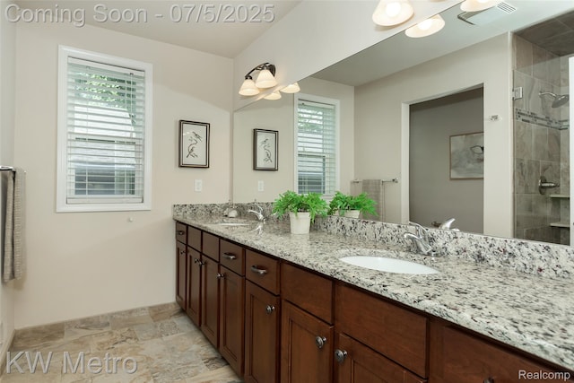 3666 Phillips Ave, Berkley, MI 48072 - full bath with double vanity, plenty of natural light, stone finish flooring, and a tile shower
