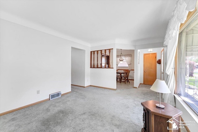 1534 London St, Lincoln Park, MI 48146 - carpeted living room featuring baseboards