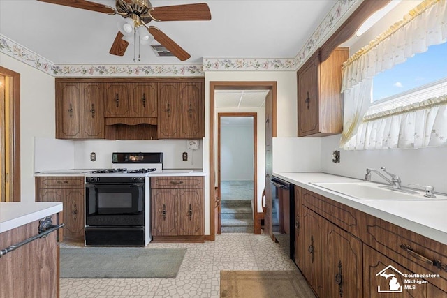 1534 London St, Lincoln Park, MI 48146 - kitchen featuring range with gas stovetop, a ceiling fan, and light countertops