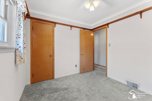 1534 London St, Lincoln Park, MI 48146 - unfurnished bedroom featuring carpet floors and a ceiling fan