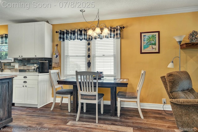 1726 Oxford Rd, Berkley, MI 48072 - dining area with a chandelier, dark wood-style floors, crown molding, and a textured ceiling