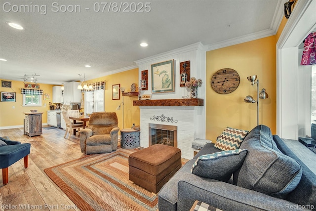 1726 Oxford Rd, Berkley, MI 48072 - living area with crown molding, recessed lighting, light wood-style flooring, a fireplace, and a chandelier