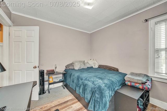 1726 Oxford Rd, Berkley, MI 48072 - bedroom with ornamental molding, multiple windows, and wood finished floors