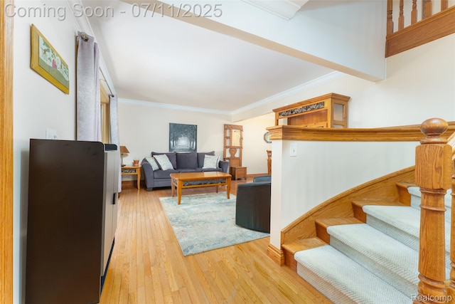 8527 Congress Dr, Canton, MI 48187 - living room with wood finished floors, ornamental molding, and stairs