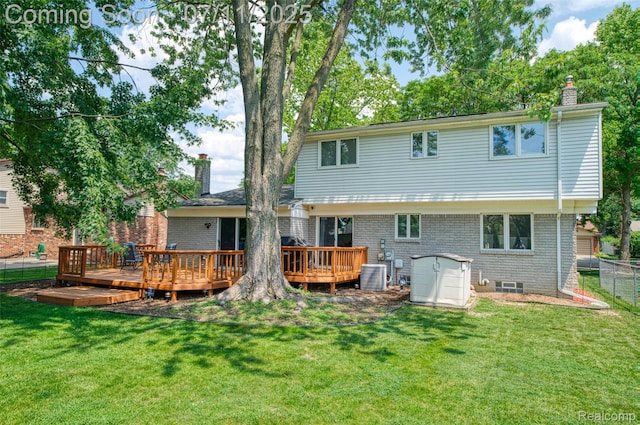 8527 Congress Dr, Canton, MI 48187 - back of property with a chimney, a deck, and brick siding