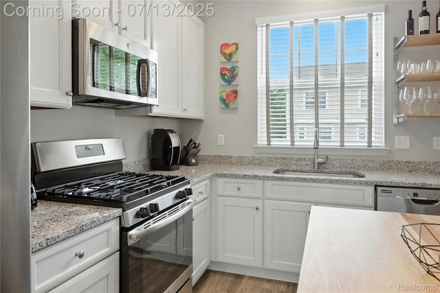 3317 Parkways Blvd, Auburn Hills, MI 48326 - kitchen featuring stainless steel appliances, open shelves, and white cabinets