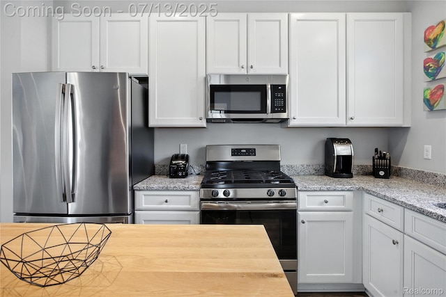 3317 Parkways Blvd, Auburn Hills, MI 48326 - kitchen featuring stainless steel appliances, white cabinetry, and wood counters