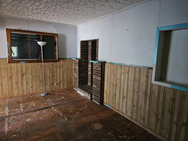 2768 W Winston Rd, Rothbury, MI 49452 - spare room featuring wooden walls and a wainscoted wall