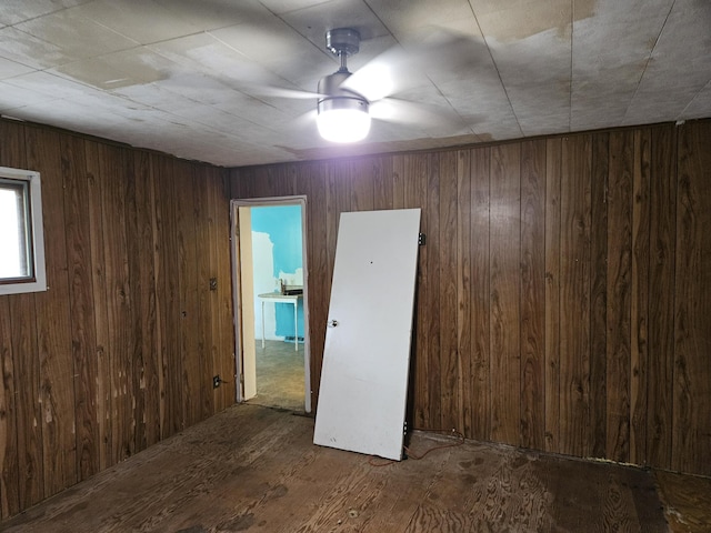 2768 W Winston Rd, Rothbury, MI 49452 - unfurnished room with wood finished floors and wood walls