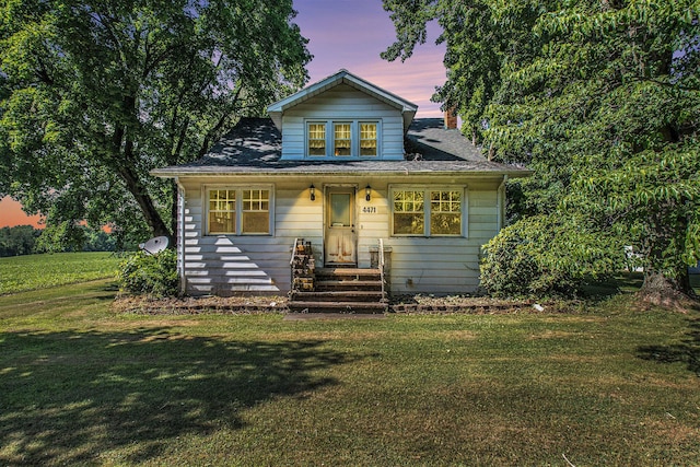 4471 Highland Ave, Benton Harbor, MI 49022 - bungalow-style home with a yard and entry steps