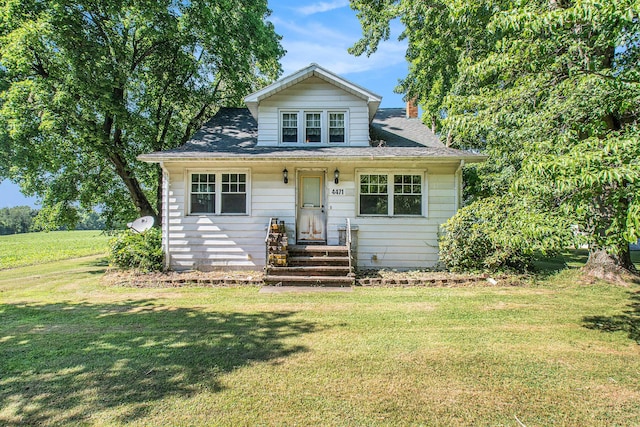 4471 Highland Ave, Benton Harbor, MI 49022 - bungalow with a front lawn and a chimney