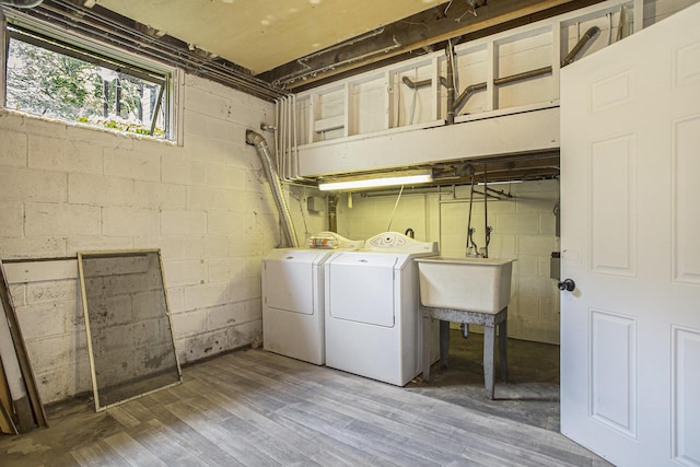 14083 M37, Battle Creek, MI 49017 - washroom featuring separate washer and dryer and wood finished floors