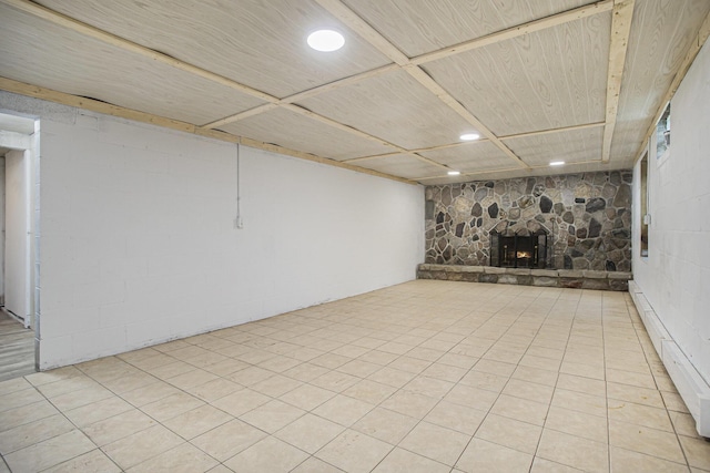 14083 M37, Battle Creek, MI 49017 - finished basement with a fireplace, concrete block wall, and recessed lighting