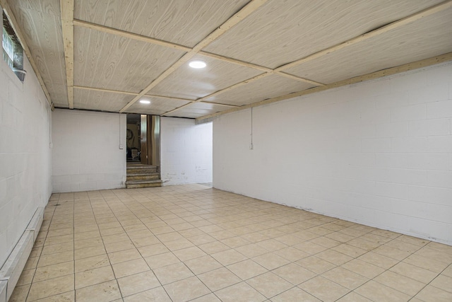 14083 M37, Battle Creek, MI 49017 - finished below grade area with concrete block wall, a baseboard radiator, and stairway