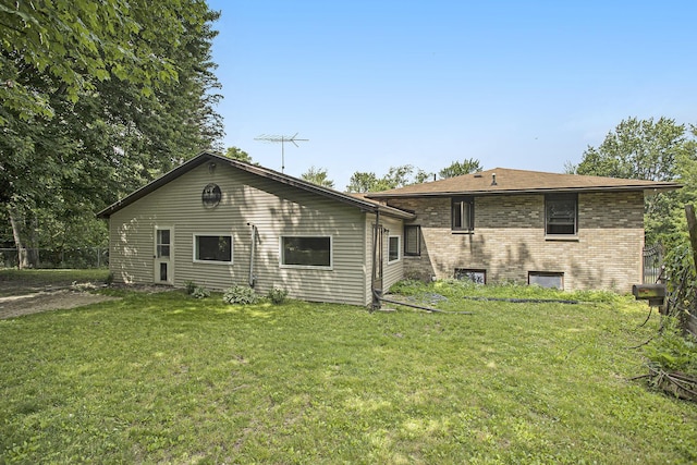 14083 M37, Battle Creek, MI 49017 - rear view of property with a yard and brick siding