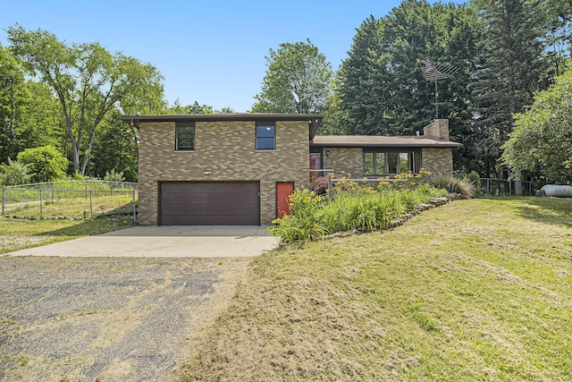 14083 M37, Battle Creek, MI 49017 - split level home featuring driveway, an attached garage, brick siding, and a chimney