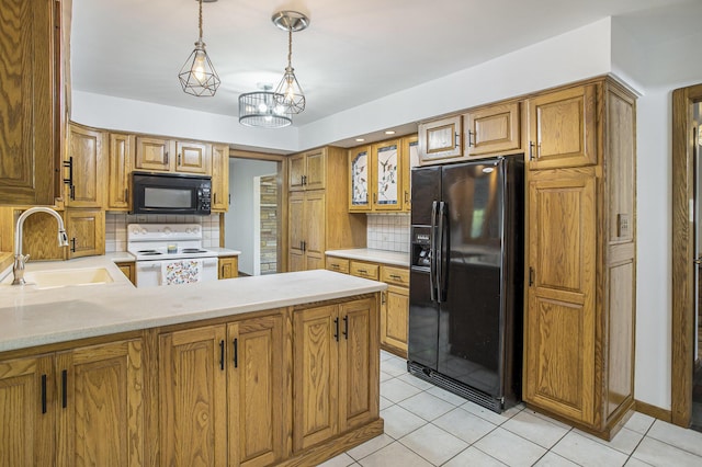 14083 M37, Battle Creek, MI 49017 - kitchen featuring black appliances, light countertops, backsplash, light tile patterned flooring, and brown cabinetry
