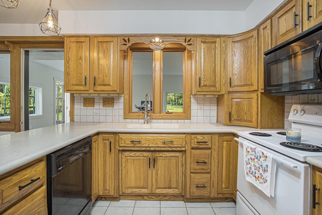 14083 M37, Battle Creek, MI 49017 - kitchen featuring black appliances, brown cabinetry, backsplash, and light countertops