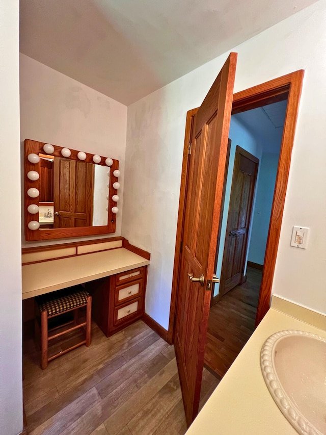 14083 M37, Battle Creek, MI 49017 - bathroom with vanity, wood finished floors, and a towel warming rack