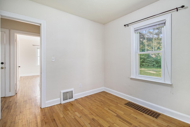 924 Royce Ave, Kalamazoo, MI 49001 - unfurnished room with baseboards and light wood-type flooring
