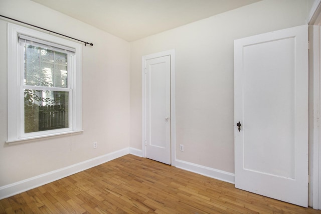 924 Royce Ave, Kalamazoo, MI 49001 - unfurnished bedroom featuring baseboards and light wood-style flooring