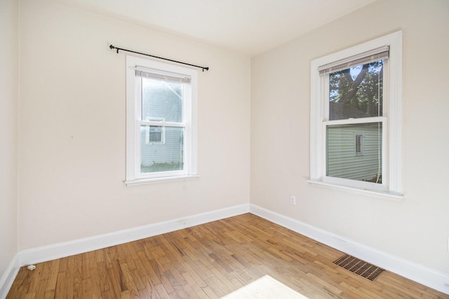 924 Royce Ave, Kalamazoo, MI 49001 - unfurnished room featuring plenty of natural light and wood finished floors