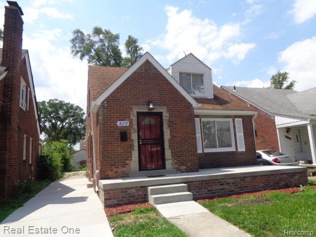 18259 Pinehurst St, Detroit, MI 48221 - view of front of house with brick siding and concrete driveway