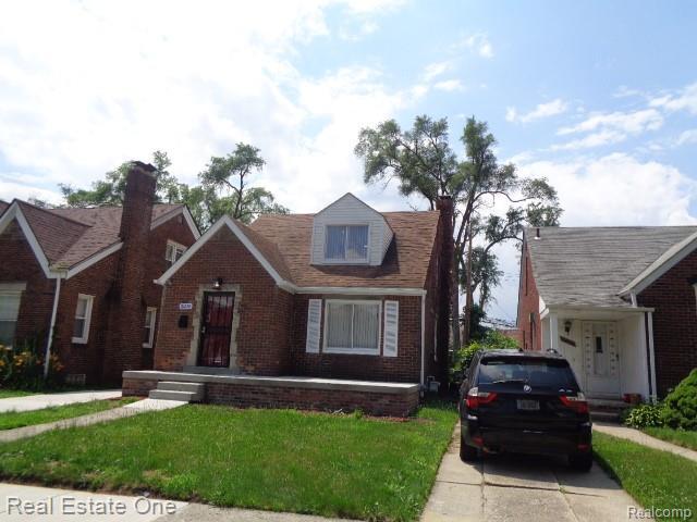 18259 Pinehurst St, Detroit, MI 48221 - view of front facade with brick siding and a front lawn