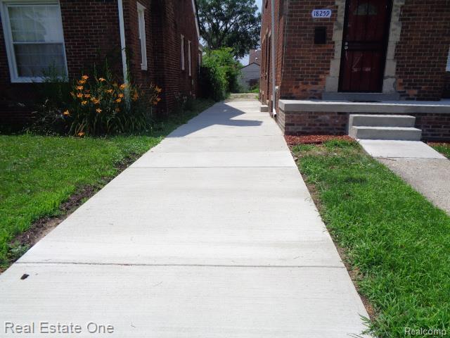 18259 Pinehurst St, Detroit, MI 48221 - doorway to property with brick siding
