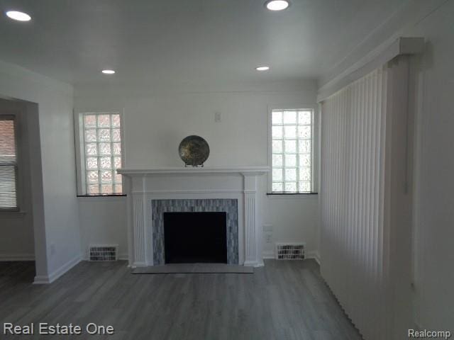 18259 Pinehurst St, Detroit, MI 48221 - unfurnished living room with wood finished floors, a fireplace with flush hearth, and recessed lighting